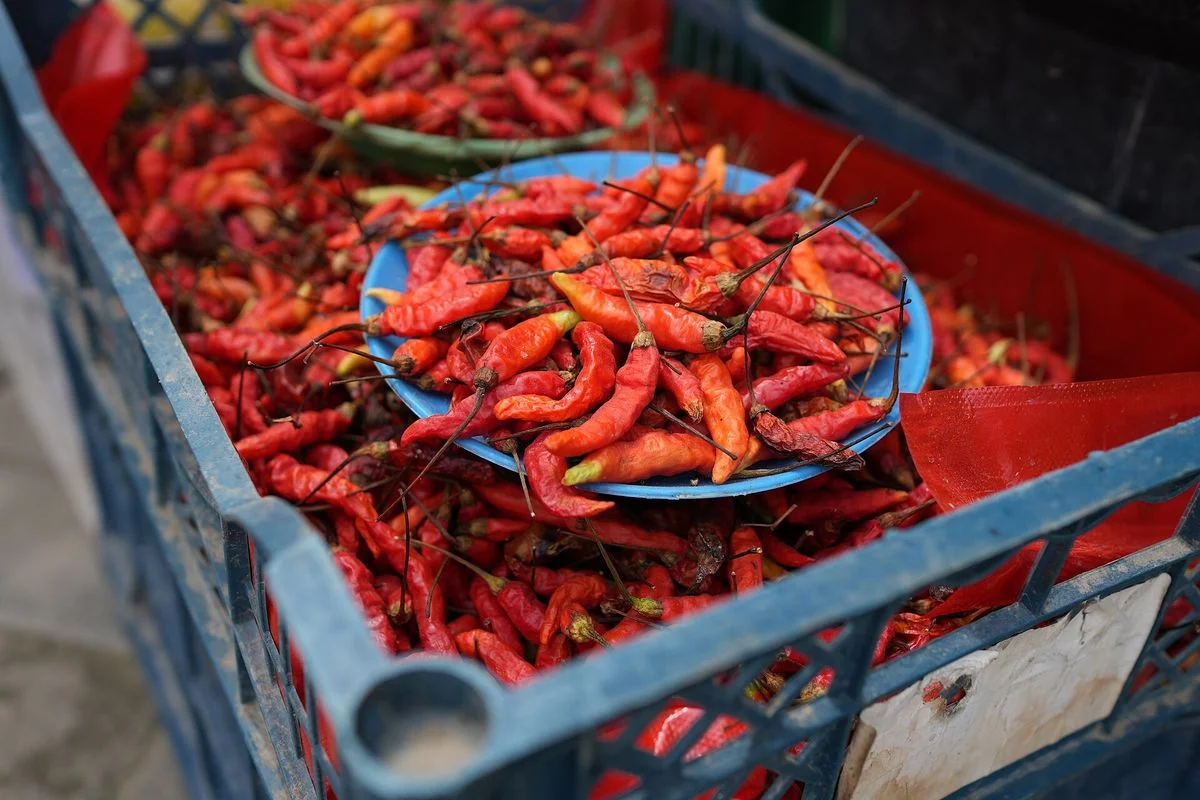 Small red chillies in a market crate